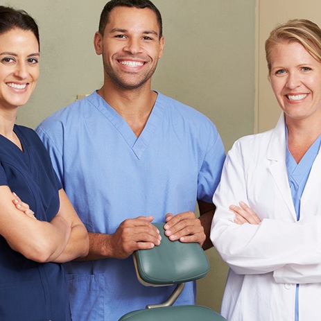 Dentist and team smiling