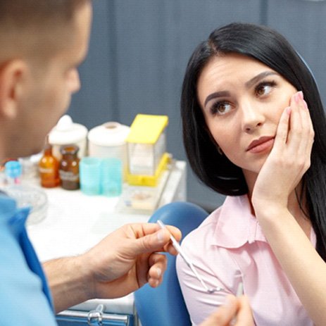 a patient suffering from tooth pain