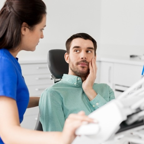Man discussing how dental injuries are treated with endodontist