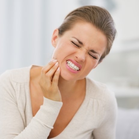 Woman in pain before endodontic surgery