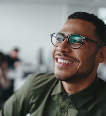 Man smiling after endodontic retreatment