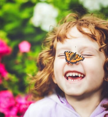 Child laughing after endodontics for children