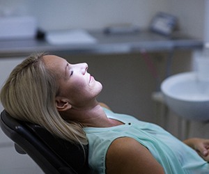 Woman relaxing in dentist's treatment chair