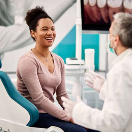 a patient visiting her dentist for a root canal