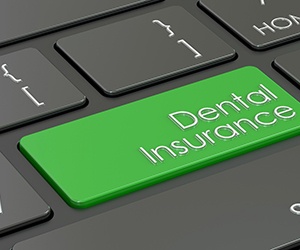a keyboard with a dental insurance button