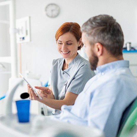 Worcester dentist explaining root canal to patient