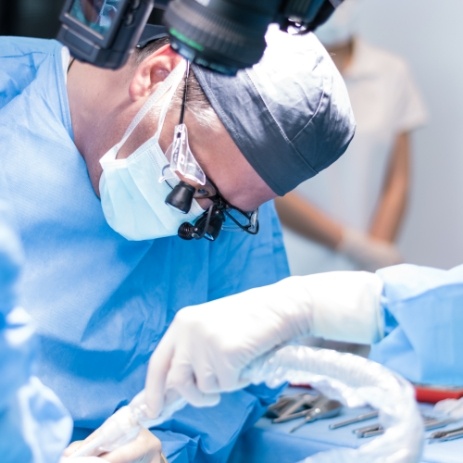 Endodontist performing endodontic surgery