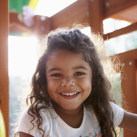 Young girl smiling after endodontics for children