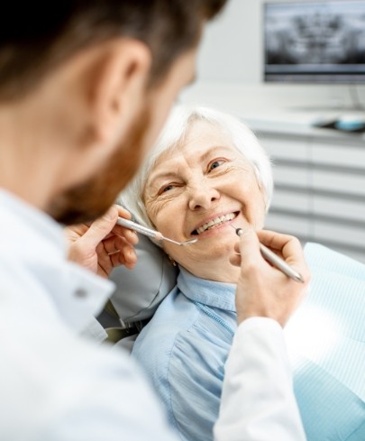 Woman receiving advanced dental services and technology