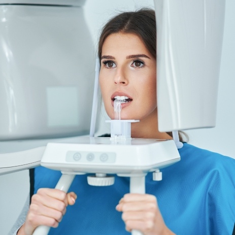 Woman receiving 3 D cone beam C T scanner x-rays