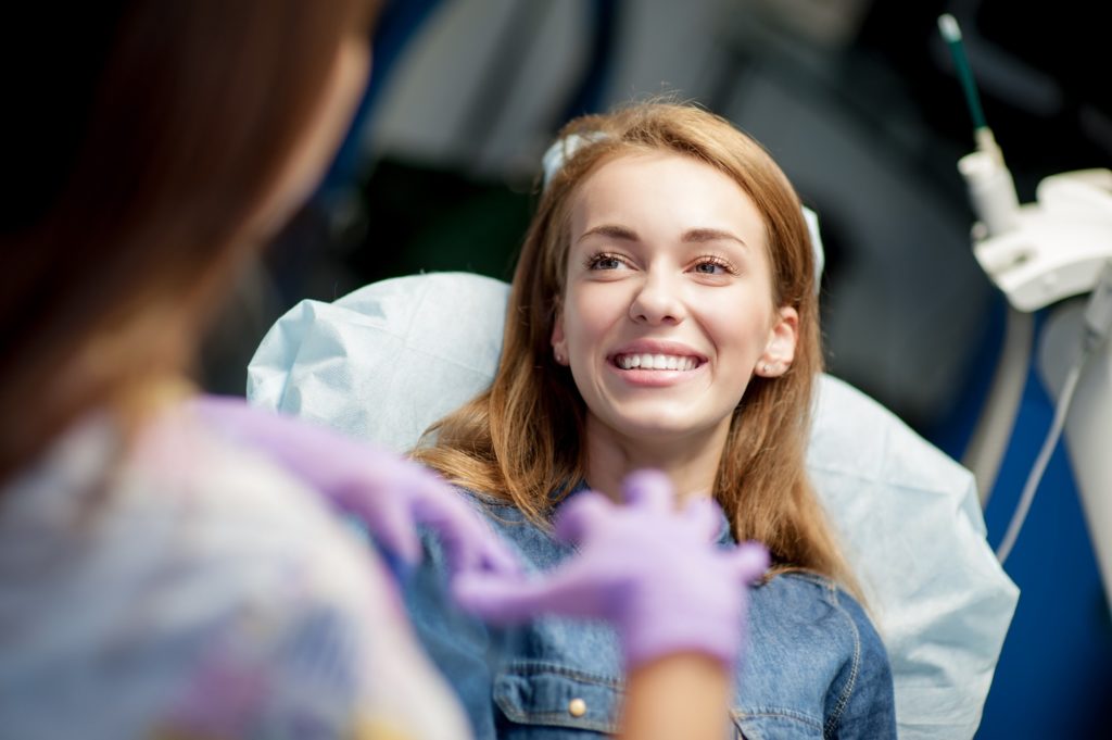 Dentist explaining root canal therapy to patient