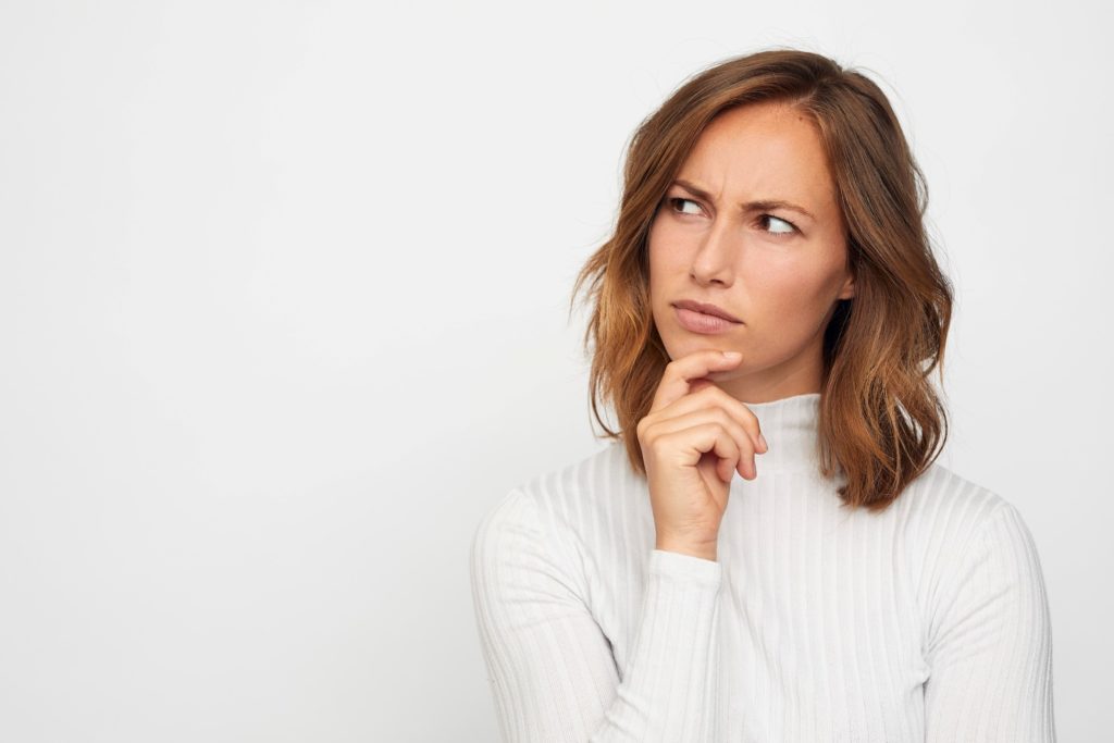 Closeup of woman wondering about root canal therapy