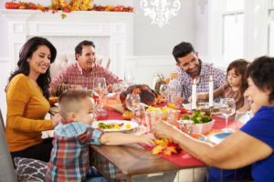 a group of people smiling and celebrating Thanksgiving