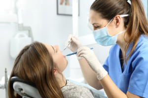 an endodontist working with a patient